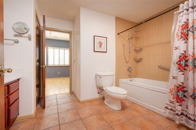 full bathroom featuring vanity, shower / bath combination with curtain, toilet, baseboards, and tile patterned floors