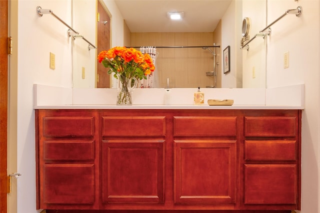 bathroom with a shower with curtain and vanity