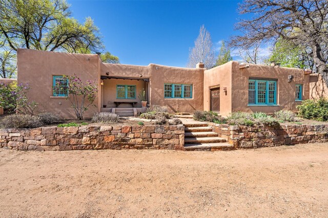 view of pueblo revival-style home