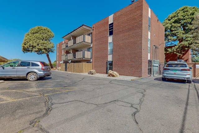 view of property with uncovered parking