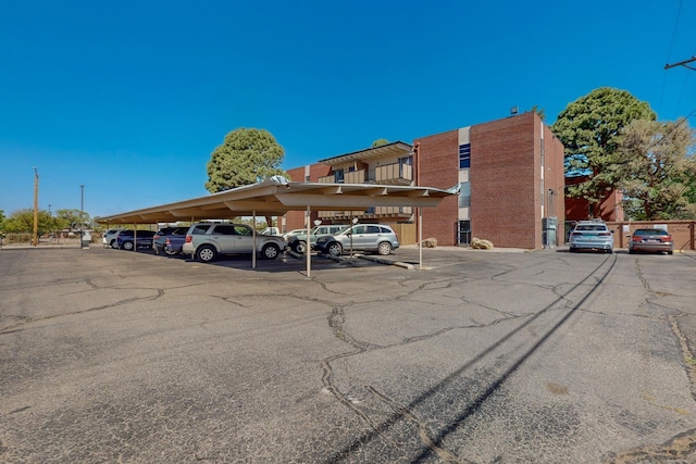 view of partially covered parking lot