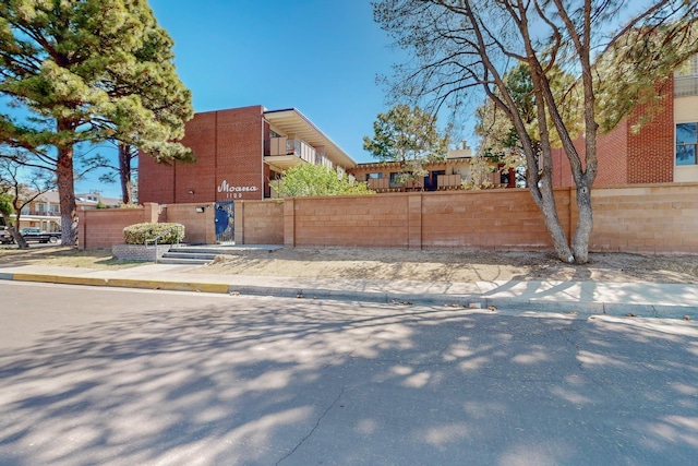 view of property exterior featuring fence private yard