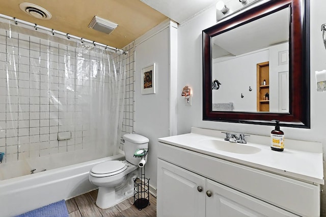 bathroom featuring shower / bath combo, vanity, toilet, wood finished floors, and visible vents