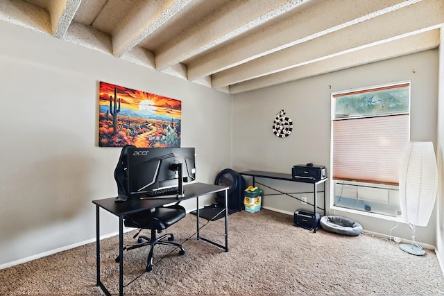 office area featuring carpet floors, baseboards, and beamed ceiling
