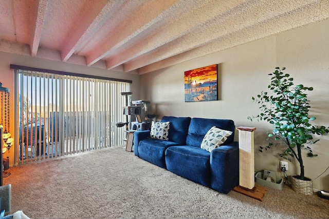 carpeted living room with beam ceiling