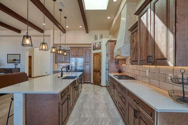 3415 Ramadan Ct NE, Rio Rancho, NM 87144 - kitchen featuring a sink, stainless steel appliances, backsplash, beamed ceiling, and visible vents