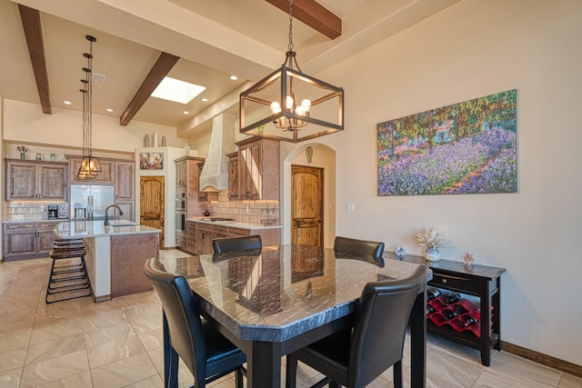 3415 Ramadan Ct NE, Rio Rancho, NM 87144 - dining space featuring visible vents, beamed ceiling, recessed lighting, arched walkways, and a notable chandelier
