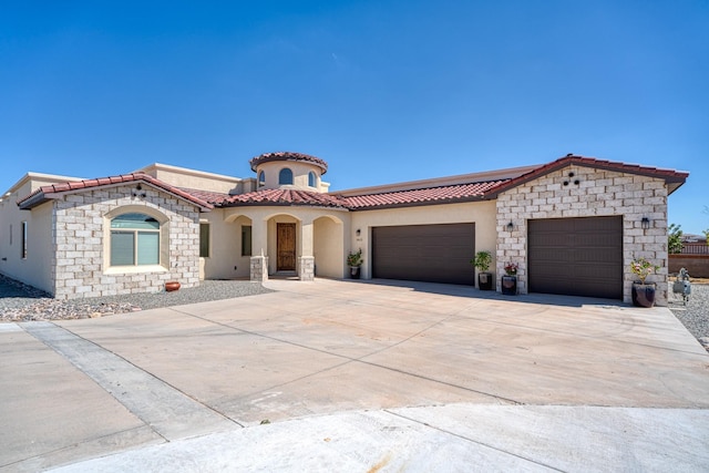 3415 Ramadan Ct NE, Rio Rancho, NM 87144 - mediterranean / spanish house with stucco siding, driveway, a tile roof, and a garage