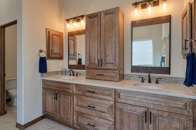 3415 Ramadan Ct NE, Rio Rancho, NM 87144 - full bathroom with double vanity, a sink, and toilet