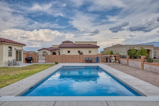 3415 Ramadan Ct NE, Rio Rancho, NM 87144 - view of pool featuring grilling area, a gate, a fenced in pool, a fenced backyard, and a patio