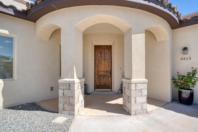 3415 Ramadan Ct NE, Rio Rancho, NM 87144 - view of exterior entry featuring stucco siding