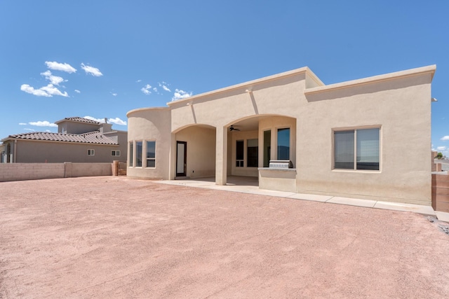 3415 Ramadan Ct NE, Rio Rancho, NM 87144 - back of house featuring fence, stucco siding, and a patio area