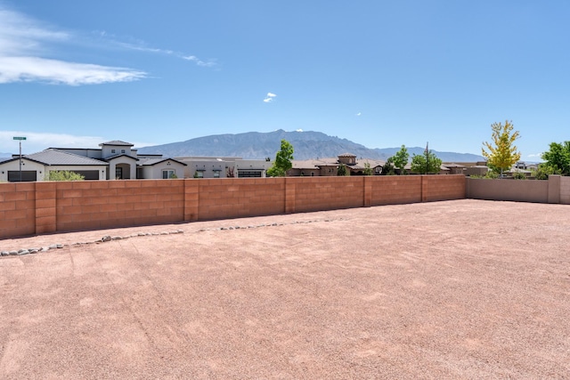 3415 Ramadan Ct NE, Rio Rancho, NM 87144 - view of yard with a fenced backyard and a mountain view