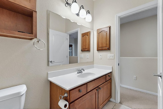 4359 San Benito St Unit B, Santa Fe, NM 87507 - bathroom with toilet, baseboards, and vanity