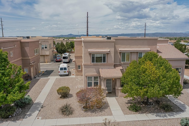 4359 San Benito St Unit B, Santa Fe, NM 87507 - view of front of property with stucco siding and a mountain view