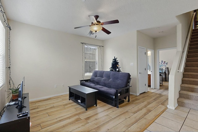 4359 San Benito St Unit B, Santa Fe, NM 87507 - sitting room with baseboards, stairway, light wood finished floors, and ceiling fan