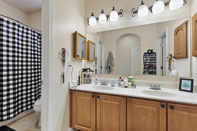 4359 San Benito St Unit B, Santa Fe, NM 87507 - full bath with double vanity, toilet, curtained shower, and a sink