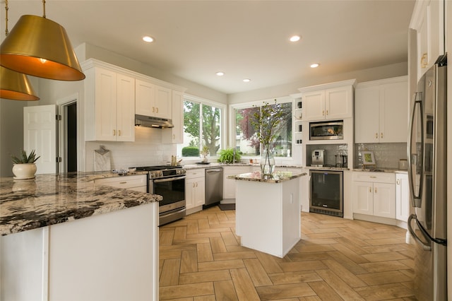 kitchen featuring beverage cooler, stainless steel appliances, tasteful backsplash, and recessed lighting