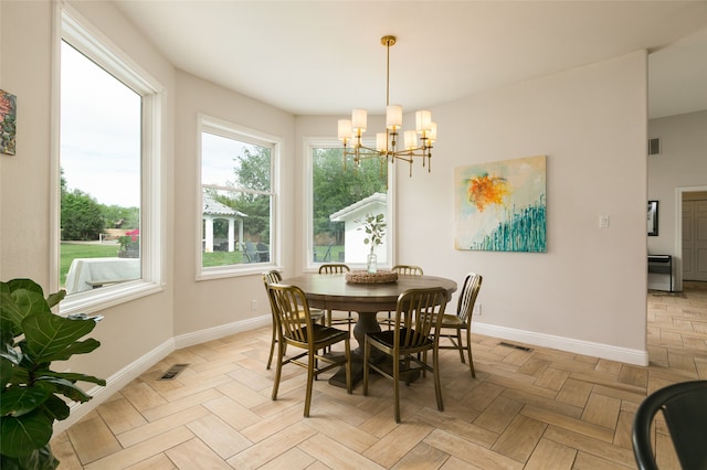dining room with an inviting chandelier, visible vents, and baseboards
