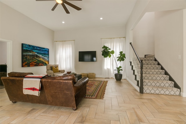 living room featuring recessed lighting, stairway, a healthy amount of sunlight, and ceiling fan