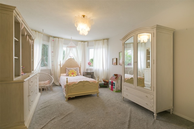 bedroom featuring a chandelier, multiple windows, and light carpet
