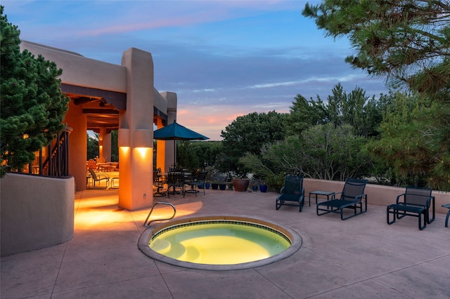 view of pool featuring an in ground hot tub and a patio area