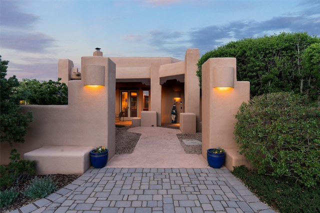 view of patio terrace at dusk
