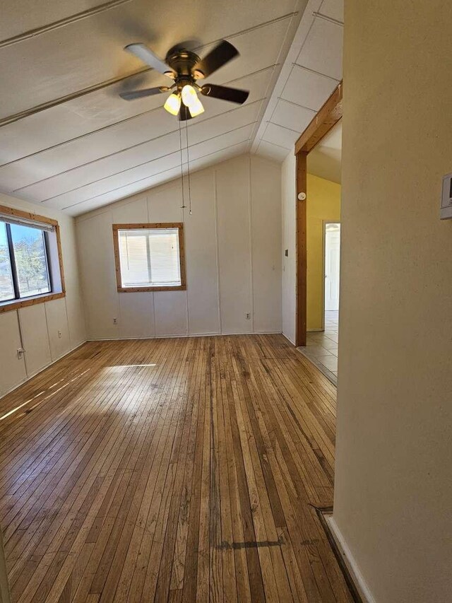 3546 Questa Dr, Los Alamos, NM 87544 - unfurnished room featuring a ceiling fan, hardwood / wood-style floors, and vaulted ceiling