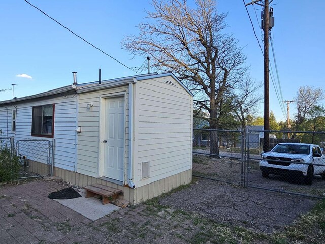 3546 Questa Dr, Los Alamos, NM 87544 - view of outbuilding featuring a gate, fence, and entry steps