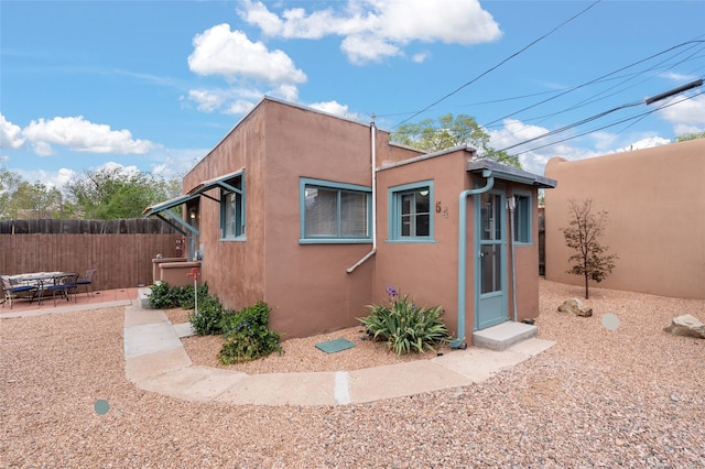 540/542 Franklin Ave, Santa Fe, NM 87501 - view of home's exterior featuring stucco siding, fence, and a patio