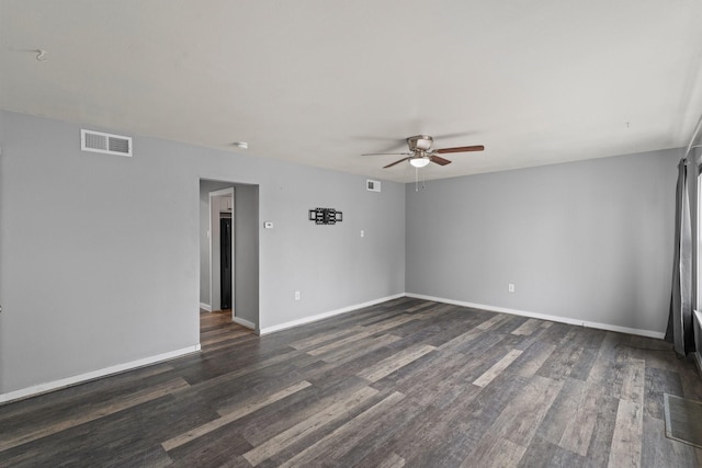 2141 44th St Unit C, Los Alamos, NM 87544 - spare room with a ceiling fan, dark wood-style floors, and baseboards