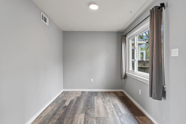 2141 44th St Unit C, Los Alamos, NM 87544 - unfurnished room with dark wood-style flooring and baseboards