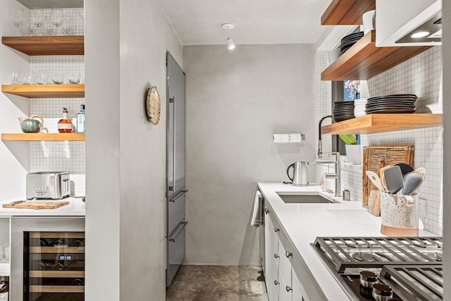 161 S Armijo Ln, Santa Fe, NM 87501 - kitchen with open shelves, decorative backsplash, appliances with stainless steel finishes, wine cooler, and white cabinetry