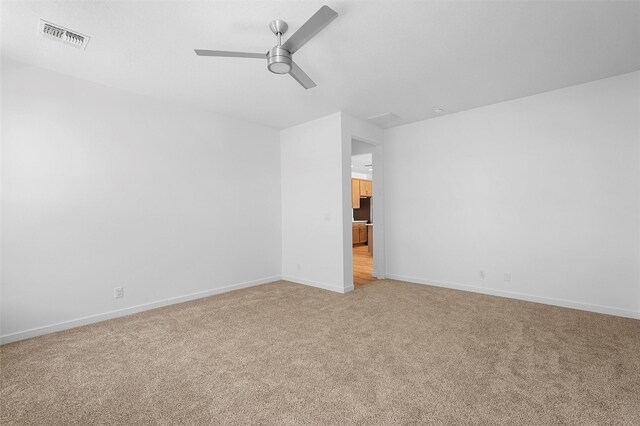 85 Cadena Blvd, Los Alamos, NM 87547 - spare room featuring light colored carpet, a ceiling fan, and baseboards