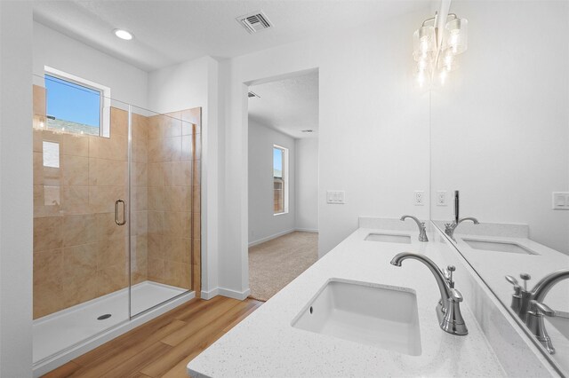 85 Cadena Blvd, Los Alamos, NM 87547 - full bathroom with a stall shower, double vanity, wood finished floors, baseboards, and recessed lighting
