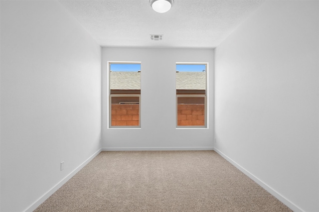 85 Cadena Blvd, Los Alamos, NM 87547 - carpeted spare room featuring baseboards and a textured ceiling