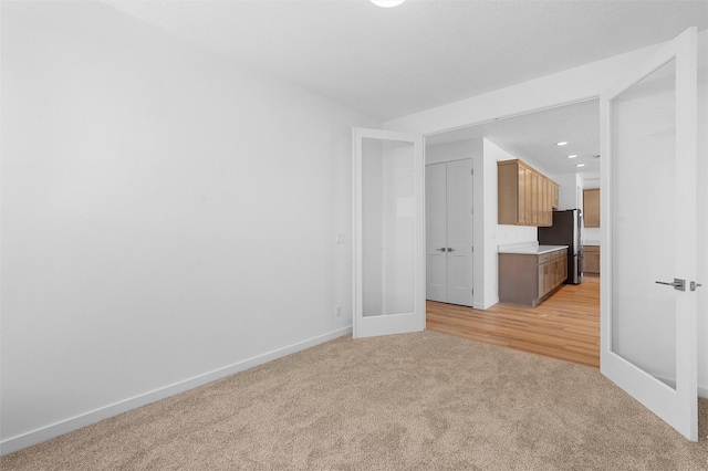 85 Cadena Blvd, Los Alamos, NM 87547 - spare room featuring light colored carpet, baseboards, and recessed lighting