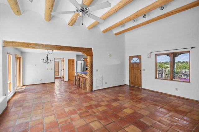 1 Azul Pl, Santa Fe, NM 87508 - unfurnished living room with beam ceiling, a chandelier, baseboards, a high ceiling, and a ceiling fan
