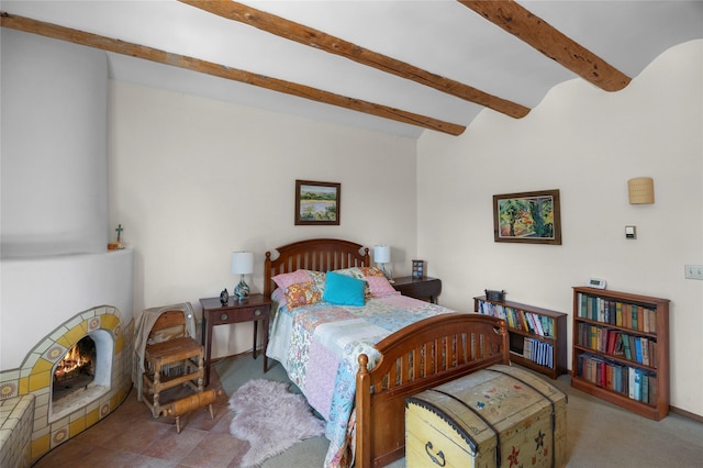 1 Azul Pl, Santa Fe, NM 87508 - carpeted bedroom with beamed ceiling and a warm lit fireplace