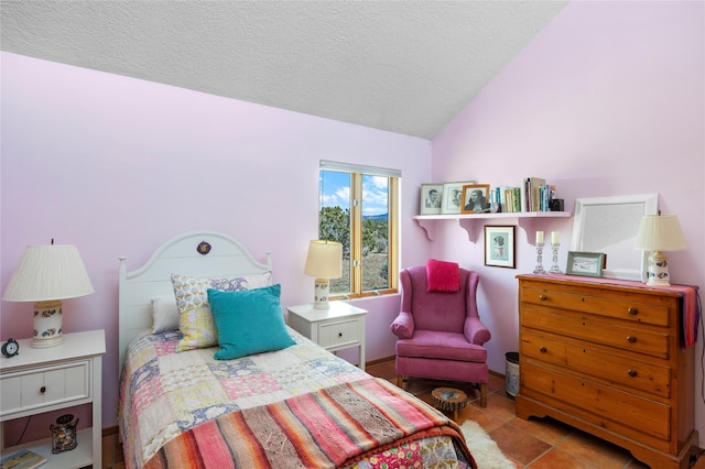 1 Azul Pl, Santa Fe, NM 87508 - tiled bedroom featuring lofted ceiling and a textured ceiling