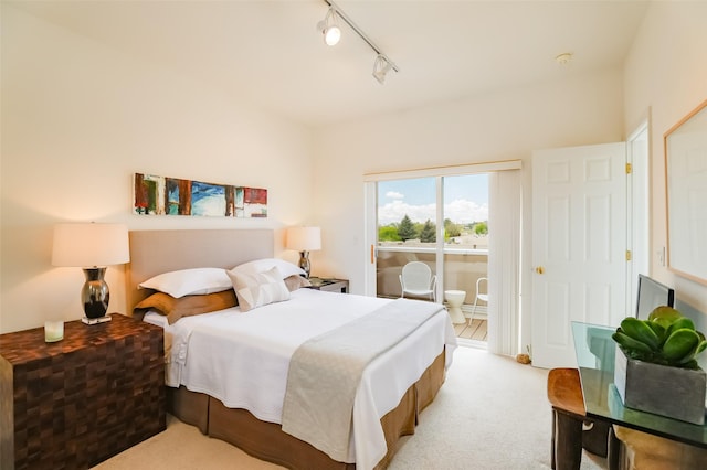 663 Bishops Lodge Rd Unit 71, Santa Fe, NM 87501 - bedroom with access to outside, track lighting, and light colored carpet