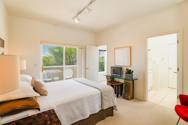 663 Bishops Lodge Rd Unit 71, Santa Fe, NM 87501 - bedroom featuring track lighting, light carpet, ensuite bathroom, and light tile patterned floors