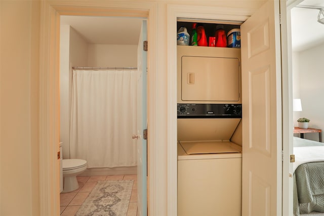663 Bishops Lodge Rd Unit 71, Santa Fe, NM 87501 - laundry room featuring estacked washer and dryer and light tile patterned floors