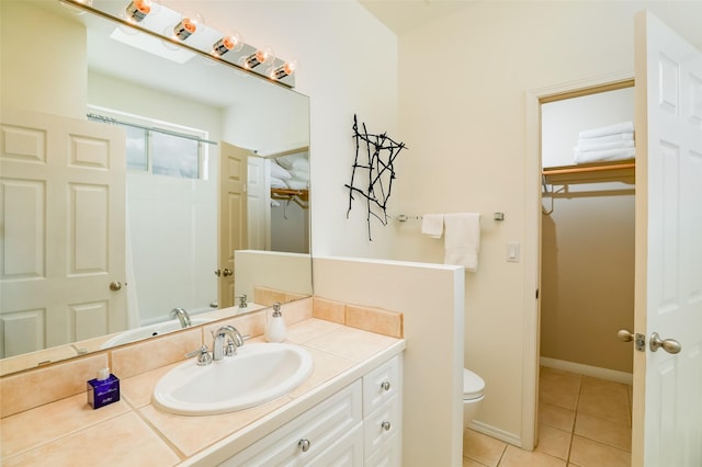 663 Bishops Lodge Rd Unit 71, Santa Fe, NM 87501 - bathroom with tile patterned flooring, toilet, a shower, and vanity