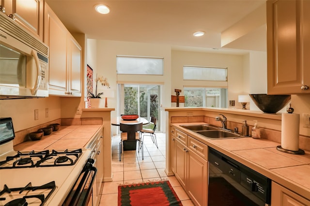 663 Bishops Lodge Rd Unit 71, Santa Fe, NM 87501 - kitchen with white appliances, tile counters, a sink, light tile patterned floors, and recessed lighting
