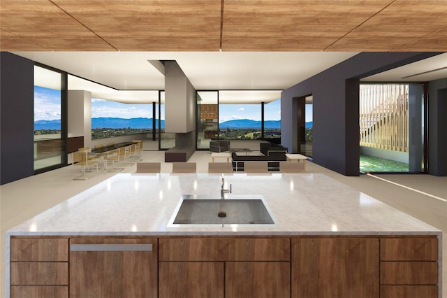 2 Silver Mesa Plz, Santa Fe, NM 87506 - kitchen with a sink, a mountain view, open floor plan, wood ceiling, and light stone counters