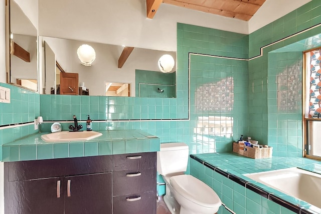 25A Lime Kiln Rd, Lamy, NM 87540 - full bathroom with tile walls, toilet, vanity, beamed ceiling, and tasteful backsplash