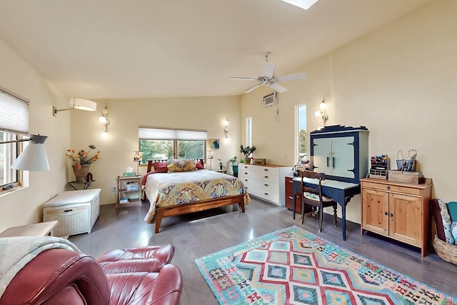 25A Lime Kiln Rd, Lamy, NM 87540 - bedroom with wood finished floors, an AC wall unit, and a ceiling fan