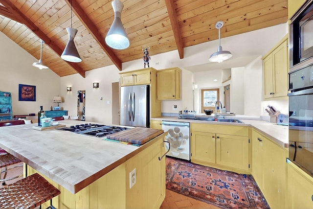 25A Lime Kiln Rd, Lamy, NM 87540 - kitchen featuring stainless steel refrigerator, dishwasher, a sink, wood ceiling, and light countertops