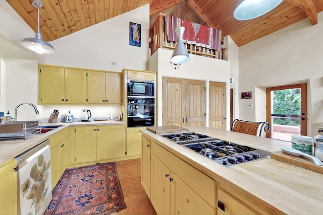 25A Lime Kiln Rd, Lamy, NM 87540 - kitchen featuring gas stovetop, oven, built in microwave, high vaulted ceiling, and light countertops